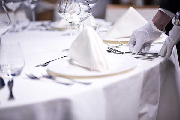 Restaurant personnel preparing the table Picture of Dining Etiquette on Light Streams Academy